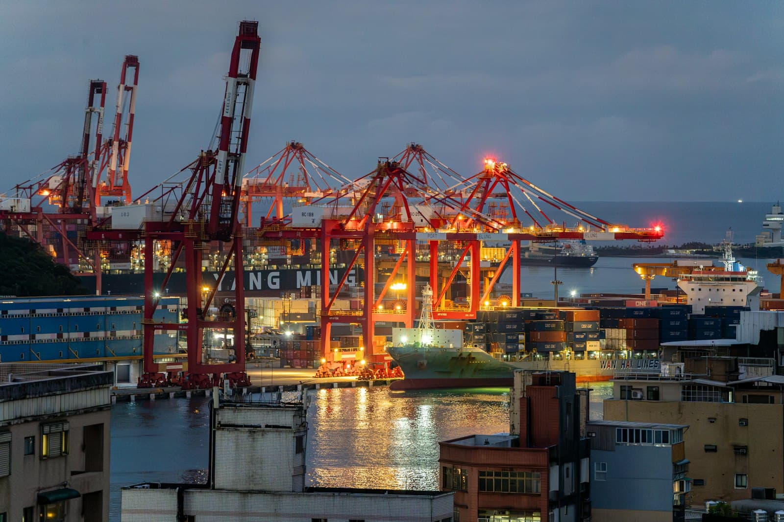 Cranes and vessels at the Port of Rotterdam at dusk
